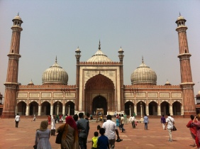 The front facade of the Jama Masjid, standing in the elevated courtyard used for prayer